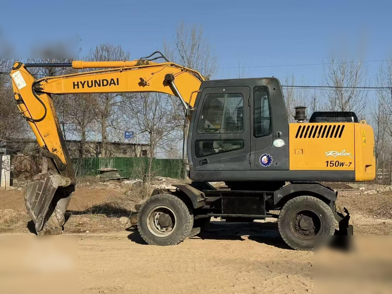 HYUNDAI ROBEX 150W-7A - Ratastel ekskavaator: pilt 1 HYUNDAI ROBEX 150W-7A - Ratastel ekskavaator: pilt 1