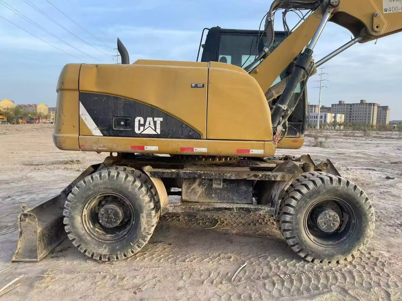 CATERPILLAR M315 - Ratastel ekskavaator: pilt 1 CATERPILLAR M315 - Ratastel ekskavaator: pilt 1