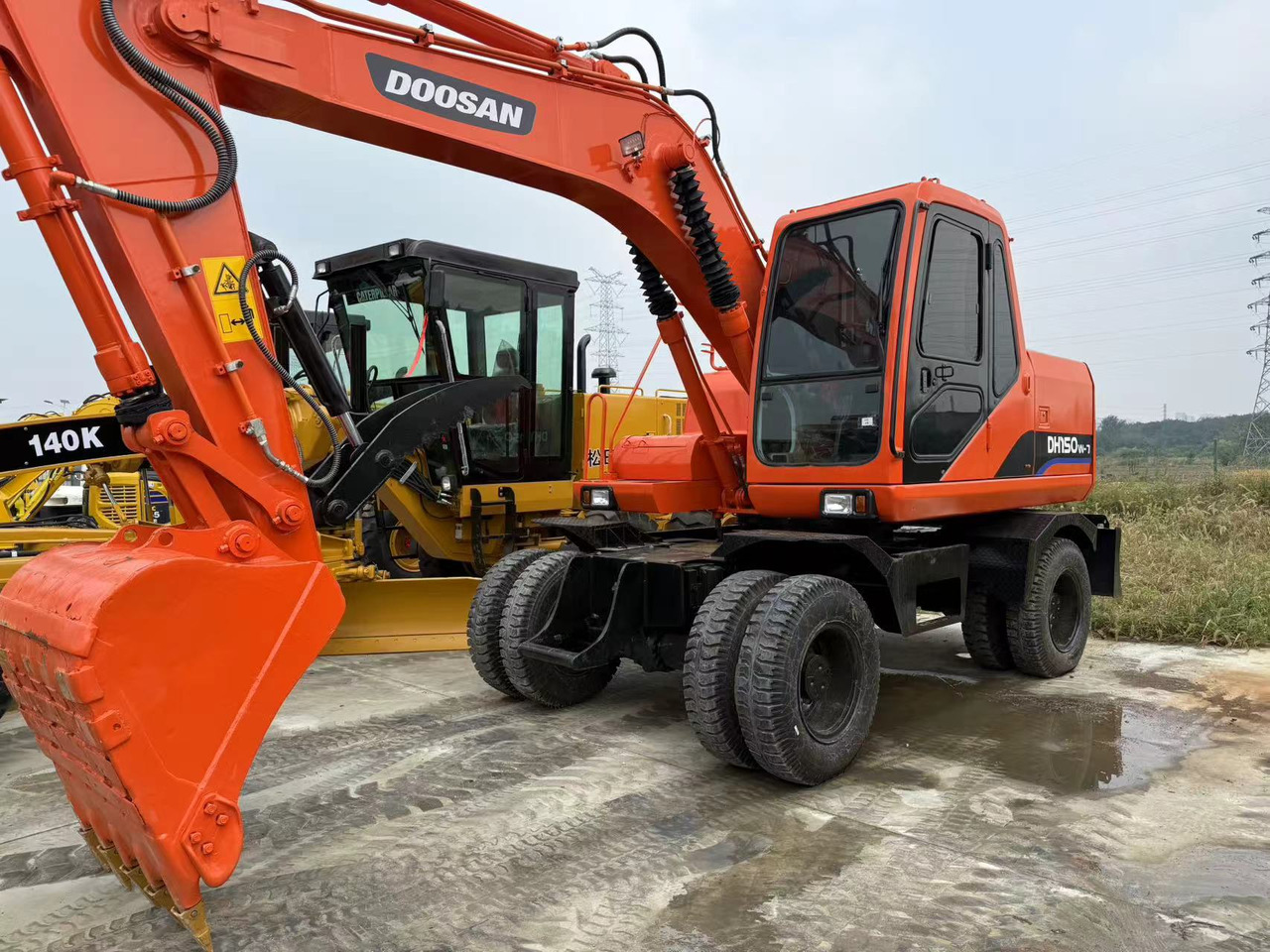DOOSAN DH150W-7 - Ratastel ekskavaator: pilt 1 DOOSAN DH150W-7 - Ratastel ekskavaator: pilt 1