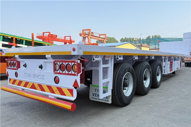 TITAN 3 Axle Flatbed Semi Trailer with Front Wall for Sale In Dominican - Konteinerveduk/ Tõstukiga poolhaagis: pilt 4 TITAN 3 Axle Flatbed Semi Trailer with Front Wall for Sale In Dominican - Konteinerveduk/ Tõstukiga poolhaagis: pilt 4