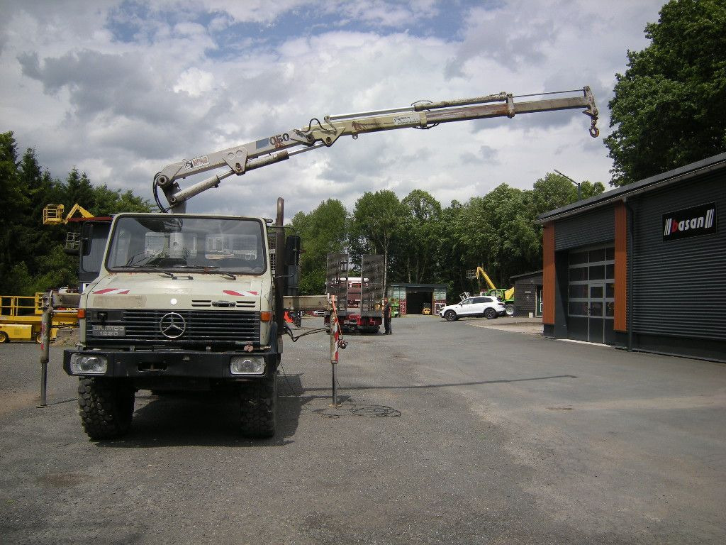 Mercedes-Benz Unimog U1250 mit Kran MKG 105 - Tarbesõiduk kallur: pilt 1 Mercedes-Benz Unimog U1250 mit Kran MKG 105 - Tarbesõiduk kallur: pilt 1