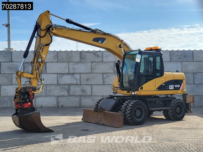 Caterpillar M313 D OUTRIGGERS + BLADE - Ratastel ekskavaator: pilt 2 Caterpillar M313 D OUTRIGGERS + BLADE - Ratastel ekskavaator: pilt 2