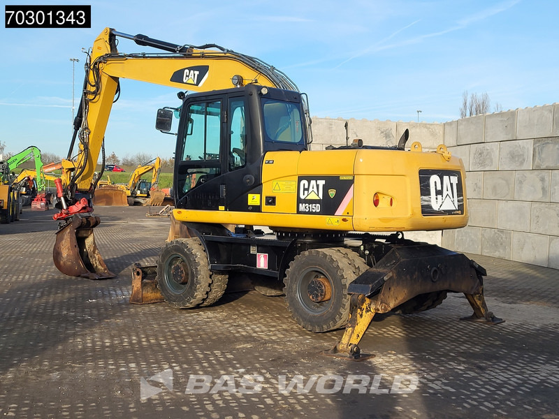 Caterpillar M315 D OUTRIGGERS + BLADE - Ratastel ekskavaator: pilt 3 Caterpillar M315 D OUTRIGGERS + BLADE - Ratastel ekskavaator: pilt 3