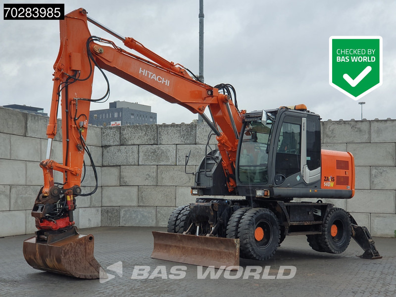 Hitachi ZX140W -3 OUTRIGGERS - ROTOTILT - Ratastel ekskavaator: pilt 1 Hitachi ZX140W -3 OUTRIGGERS - ROTOTILT - Ratastel ekskavaator: pilt 1