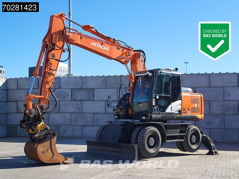 Hitachi ZX140W -5 OUTRIGGERS + BLADE - Ratastel ekskavaator: pilt 1 Hitachi ZX140W -5 OUTRIGGERS + BLADE - Ratastel ekskavaator: pilt 1