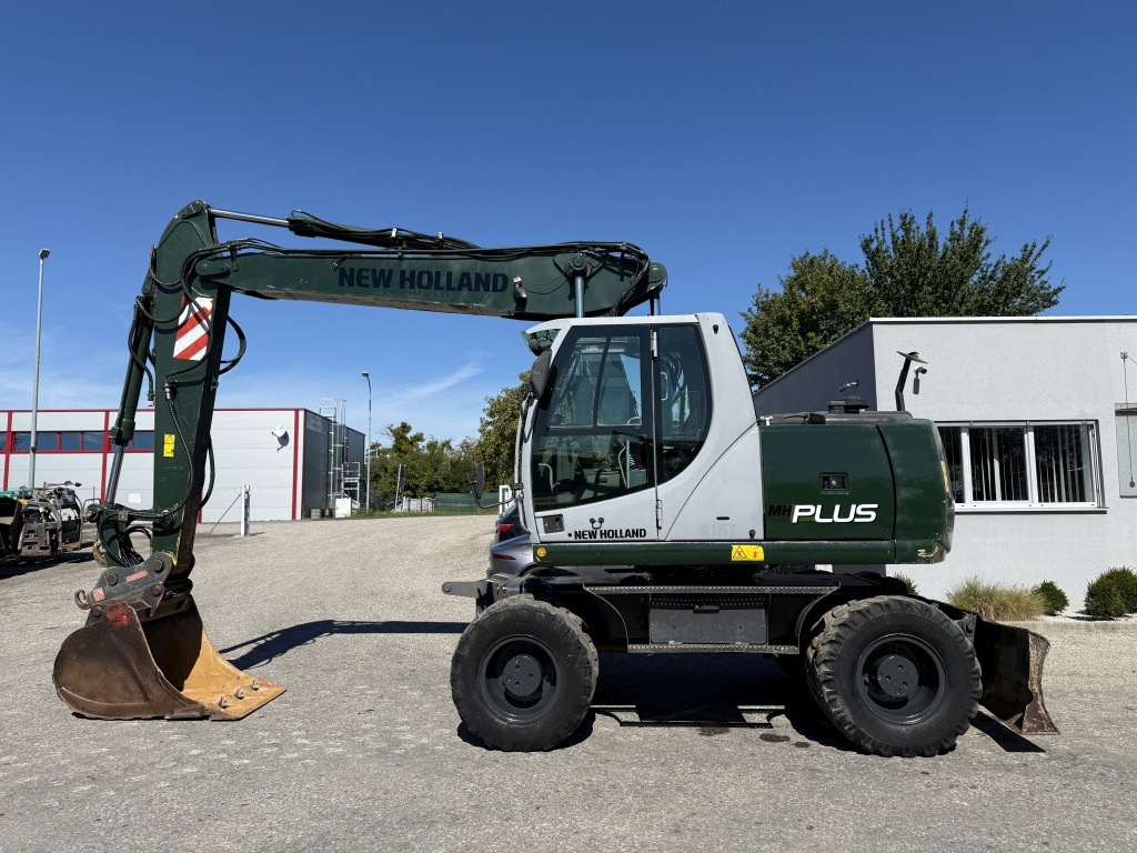 New Holland MH-Plus (111695) - Ratastel ekskavaator: pilt 1 New Holland MH-Plus (111695) - Ratastel ekskavaator: pilt 1