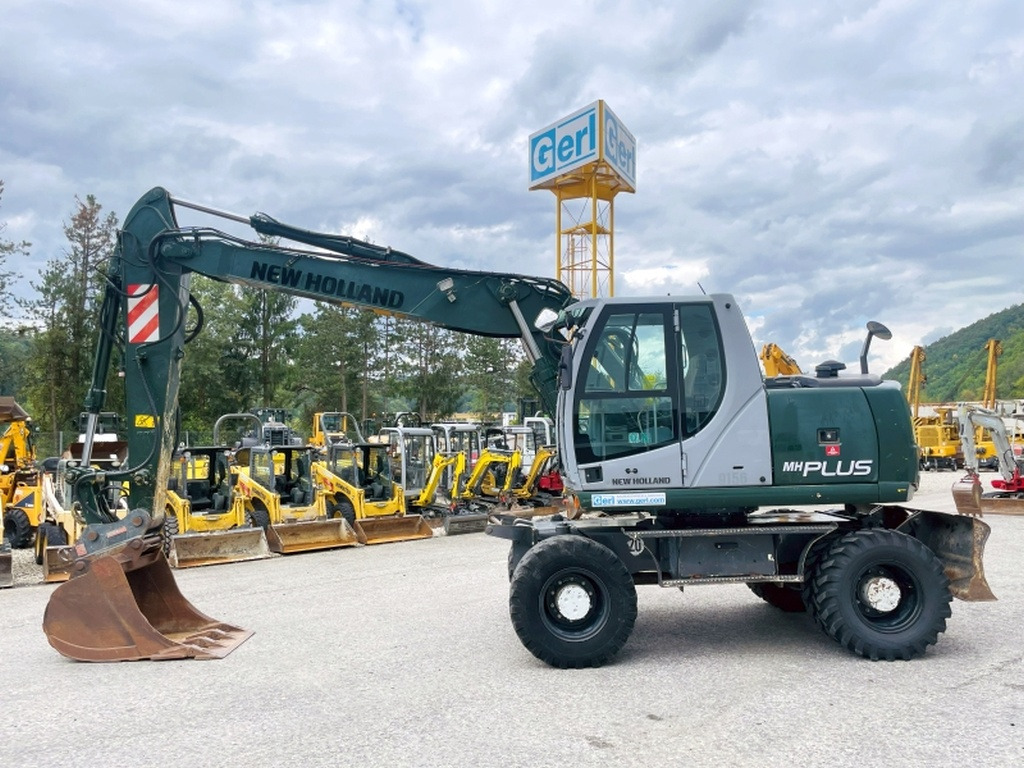 New Holland MH Plus (4054) - Ratastel ekskavaator: pilt 1 New Holland MH Plus (4054) - Ratastel ekskavaator: pilt 1