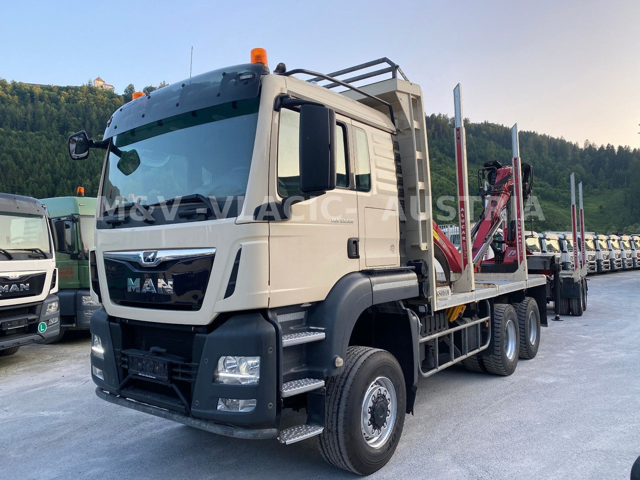 MAN 33.500 6X6 mit Kran PENZ 12Z - Metsaveok, Kraanaga veoauto: pilt 1 MAN 33.500 6X6 mit Kran PENZ 12Z - Metsaveok, Kraanaga veoauto: pilt 1