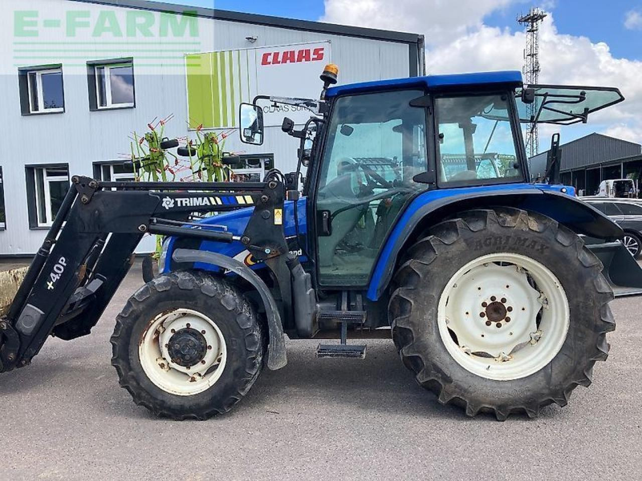 New Holland tl 100 a A - Traktor: pilt 1 New Holland tl 100 a A - Traktor: pilt 1