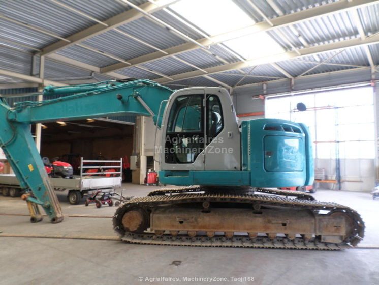 New Holland Kobelco Kobelco E 235 BSR-2 E 235 BSR-2 - Lintekskavaator: pilt 1 New Holland Kobelco Kobelco E 235 BSR-2 E 235 BSR-2 - Lintekskavaator: pilt 1