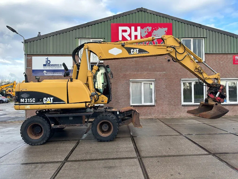 Caterpillar M315C WITH ROTOTILT, CE - Ratastel ekskavaator: pilt 2 Caterpillar M315C WITH ROTOTILT, CE - Ratastel ekskavaator: pilt 2