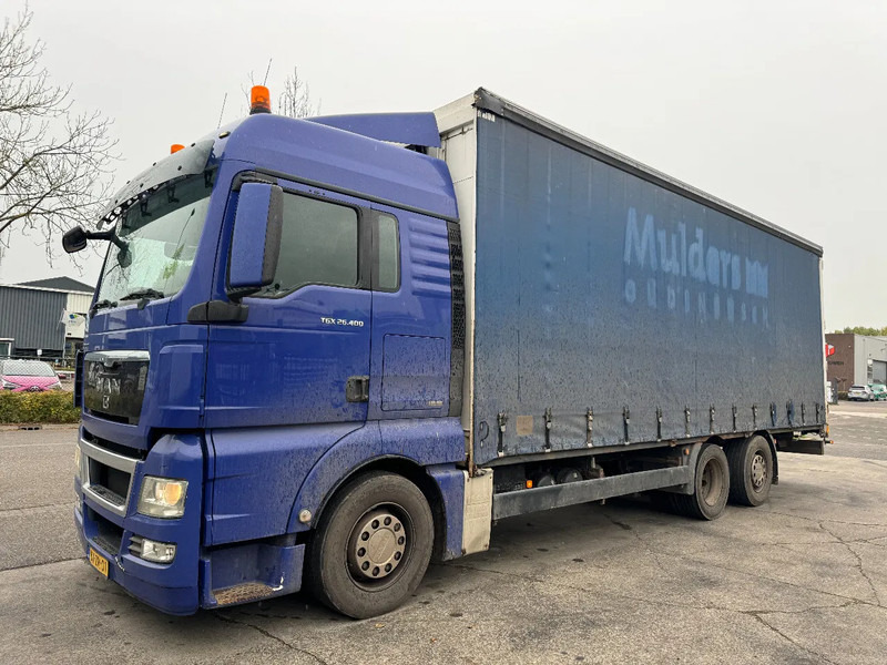 MAN TGX 26.400 6X2 - EURO 4 + LIFT + STEERING AXLE + TÜV 10-2025 - Tent veoauto: pilt 1 MAN TGX 26.400 6X2 - EURO 4 + LIFT + STEERING AXLE + TÜV 10-2025 - Tent veoauto: pilt 1