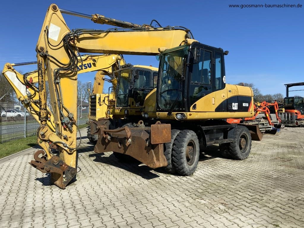 CAT M 315D - Ratastel ekskavaator: pilt 1 CAT M 315D - Ratastel ekskavaator: pilt 1