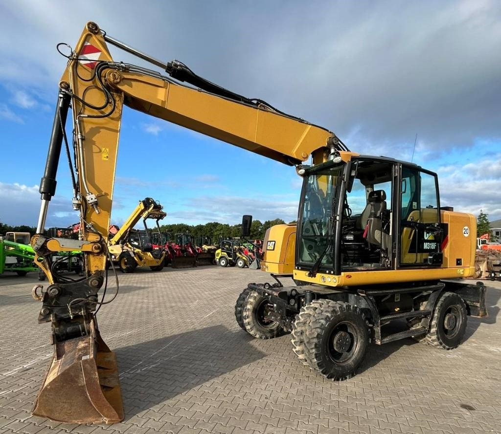 CAT M 318 F - Ratastel ekskavaator: pilt 1 CAT M 318 F - Ratastel ekskavaator: pilt 1