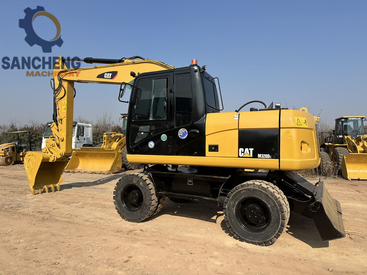 CATERPILLAR M320D2 - Ratastel ekskavaator: pilt 1 CATERPILLAR M320D2 - Ratastel ekskavaator: pilt 1