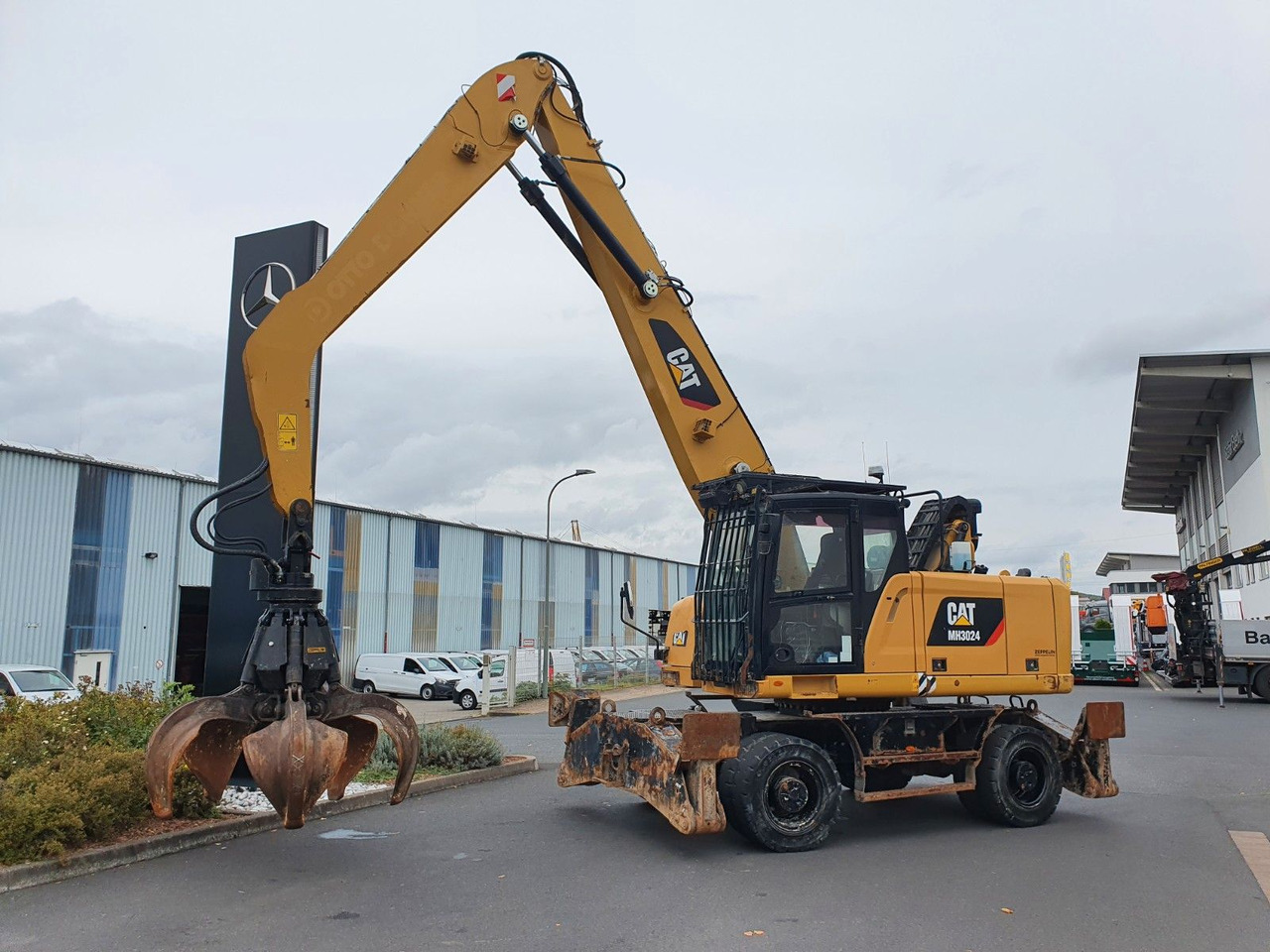 CAT MH3024 / MH 3024 / Greifer / 2018 / 9.424h - Ratastel ekskavaator: pilt 2 CAT MH3024 / MH 3024 / Greifer / 2018 / 9.424h - Ratastel ekskavaator: pilt 2