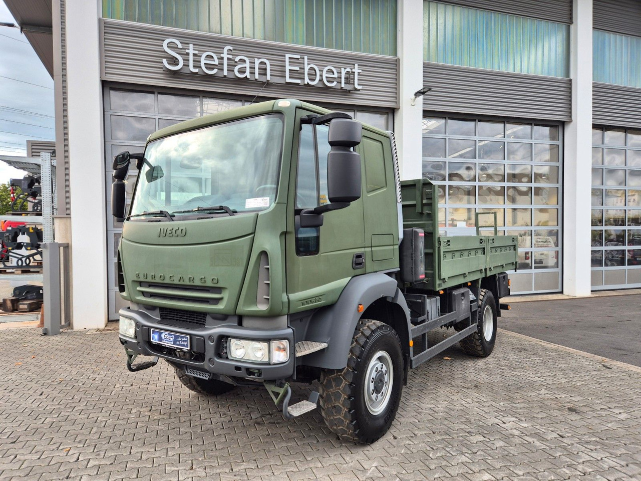 Iveco Eurocargo ML100E22WM-BW 4x4 Pritsche L-Haus Bett - Madelveok/ Platvormveok: pilt 1 Iveco Eurocargo ML100E22WM-BW 4x4 Pritsche L-Haus Bett - Madelveok/ Platvormveok: pilt 1