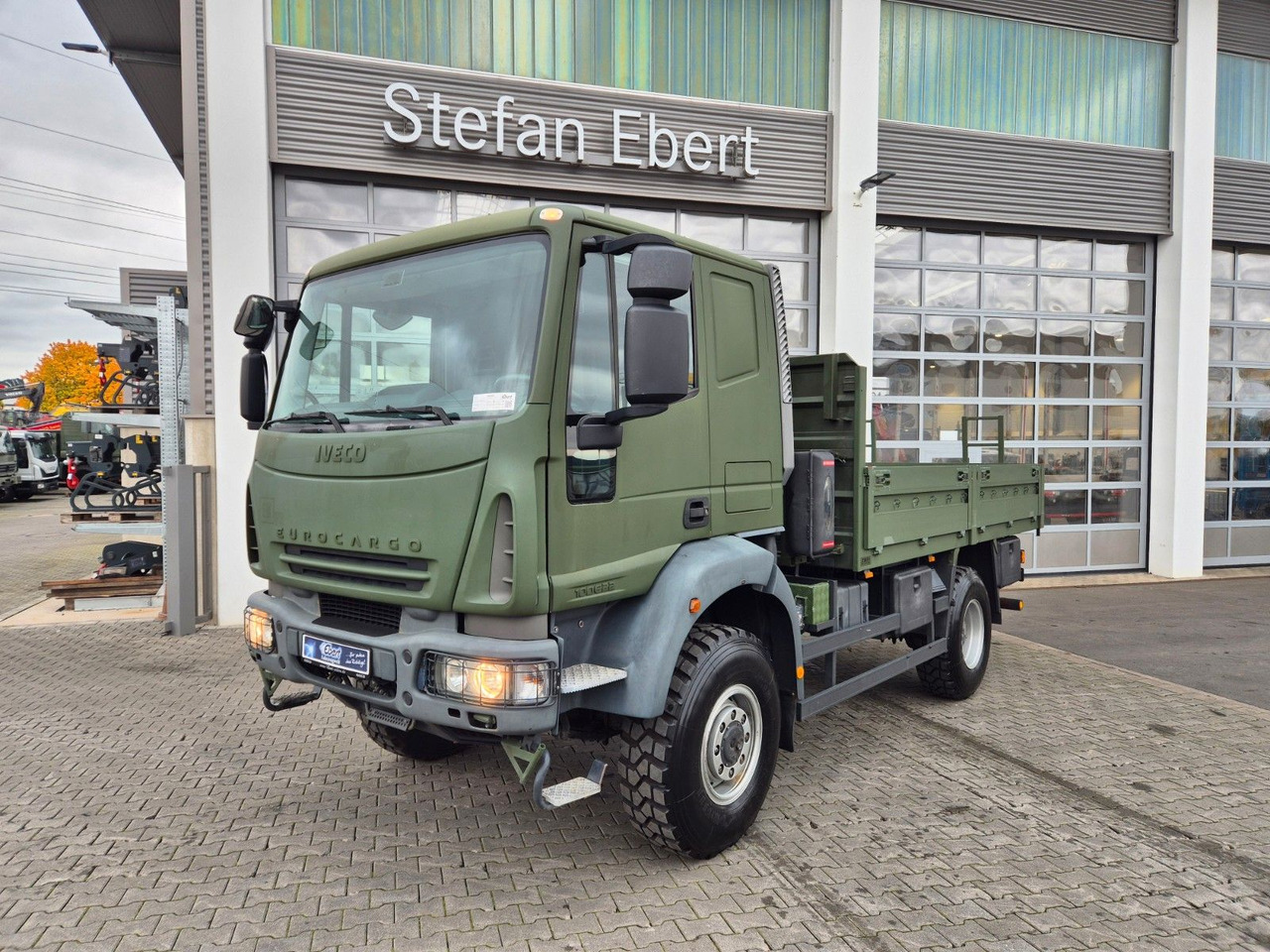 Iveco Eurocargo ML100E22WM-BW 4x4 Pritsche L-Haus Bett - Madelveok/ Platvormveok: pilt 1 Iveco Eurocargo ML100E22WM-BW 4x4 Pritsche L-Haus Bett - Madelveok/ Platvormveok: pilt 1