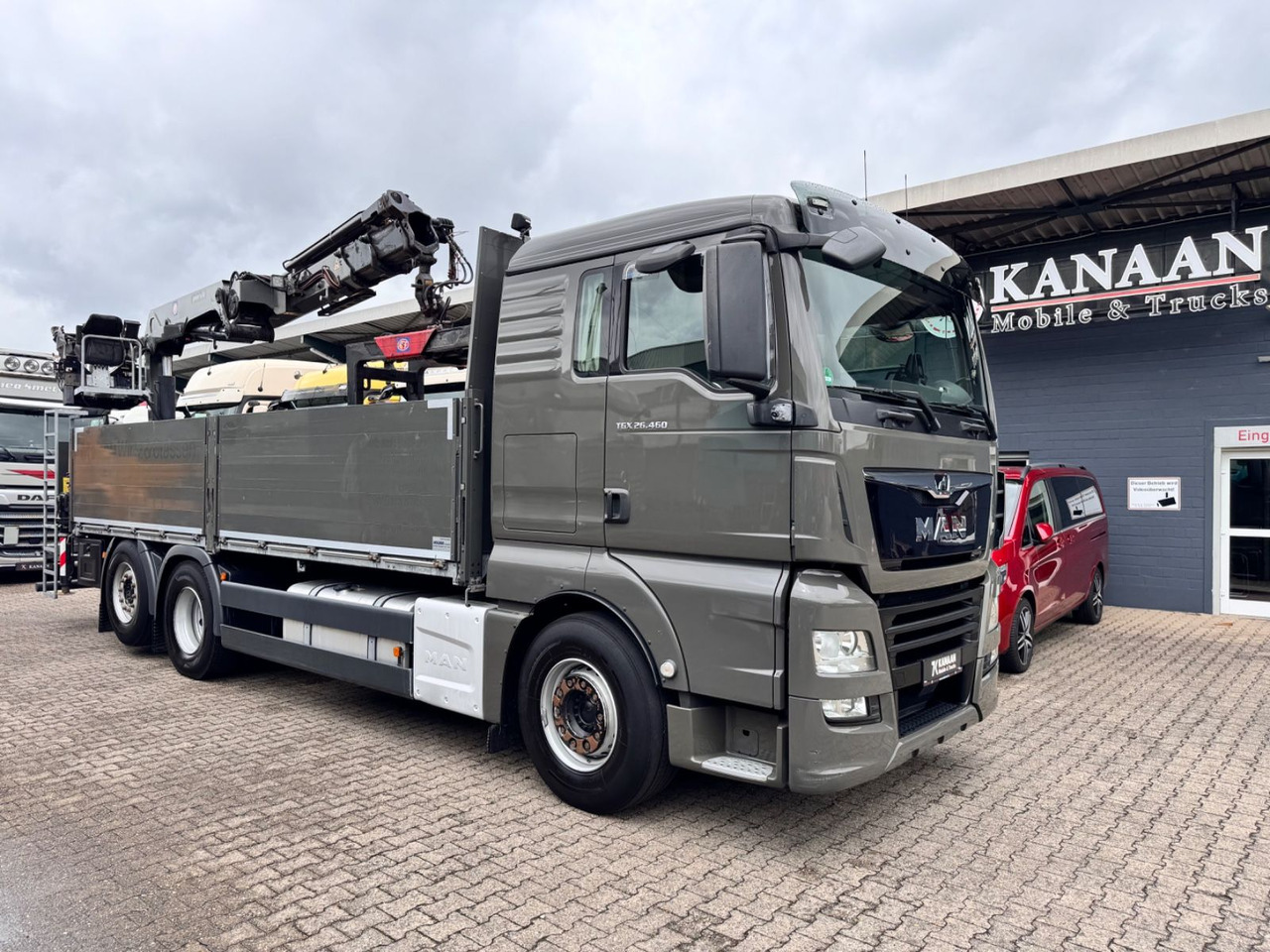 MAN 26.460 TGX Baustoffkran HMF 2110-L3 - Kraanaga veoauto: pilt 1 MAN 26.460 TGX Baustoffkran HMF 2110-L3 - Kraanaga veoauto: pilt 1