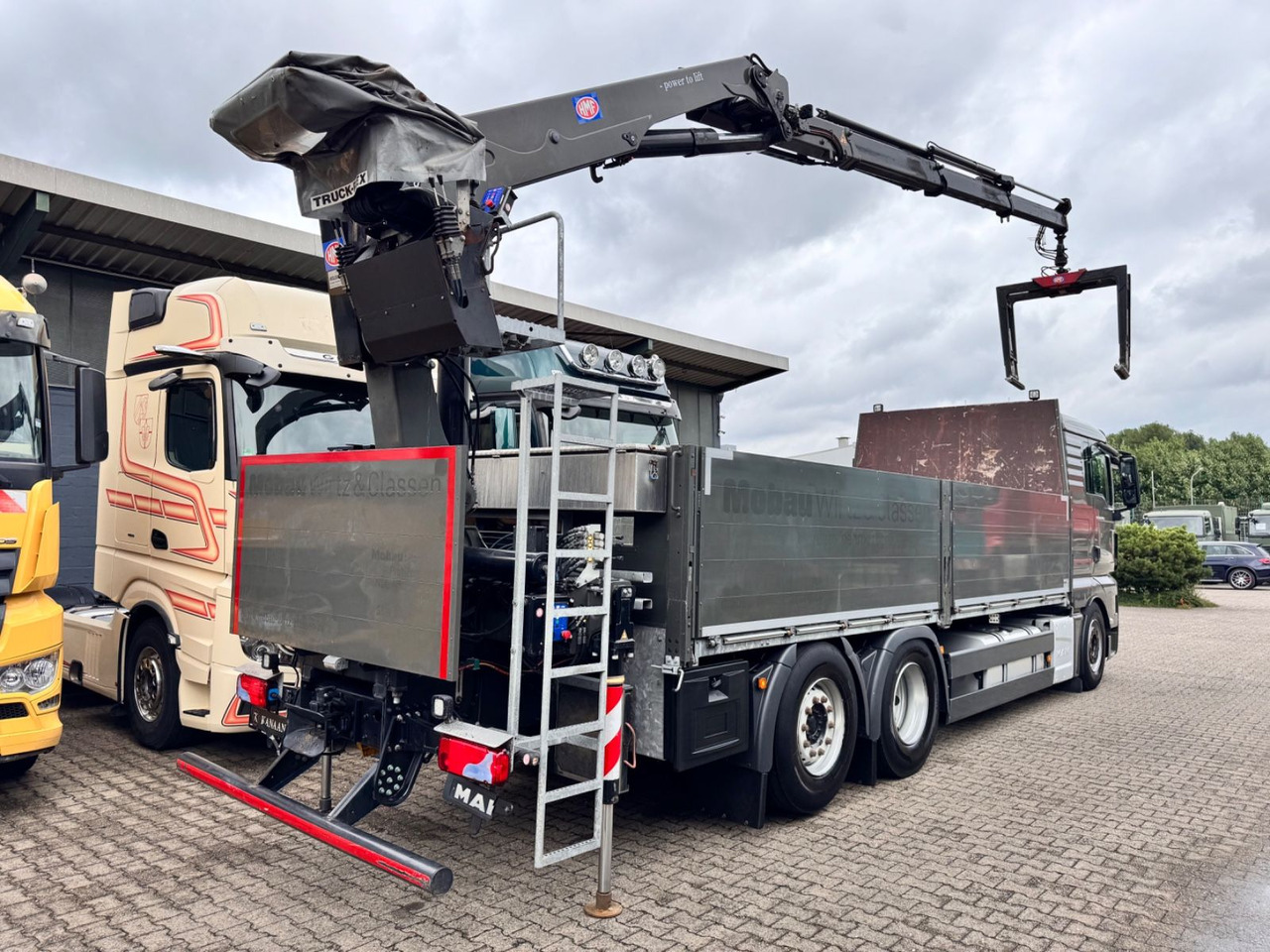 MAN 26.460 TGX Baustoffkran HMF 2110-L3 - Kraanaga veoauto: pilt 5 MAN 26.460 TGX Baustoffkran HMF 2110-L3 - Kraanaga veoauto: pilt 5